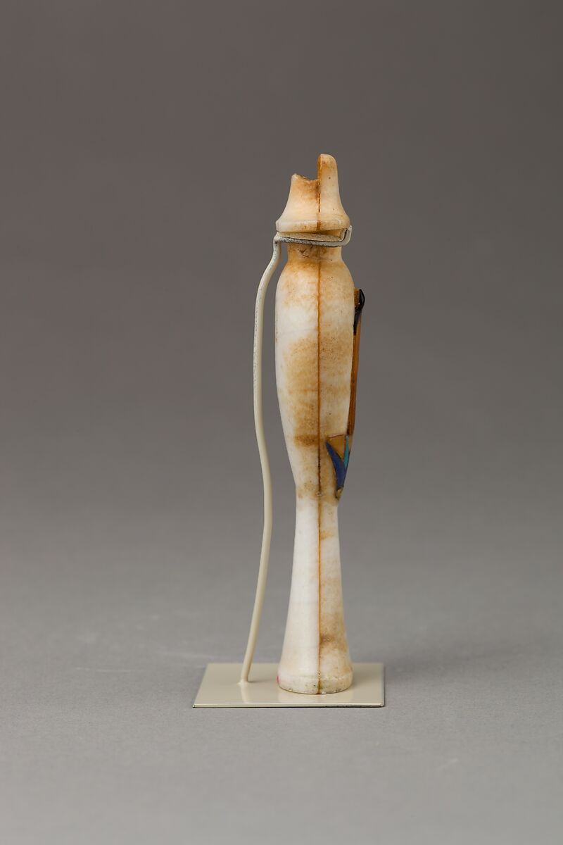 Perfume bottle in the shape of a hes-vase inlaid with the figure of a princess, Travertine (Egyptian alabaster), carnelian, obsidian,gold,  and colored glass inlay