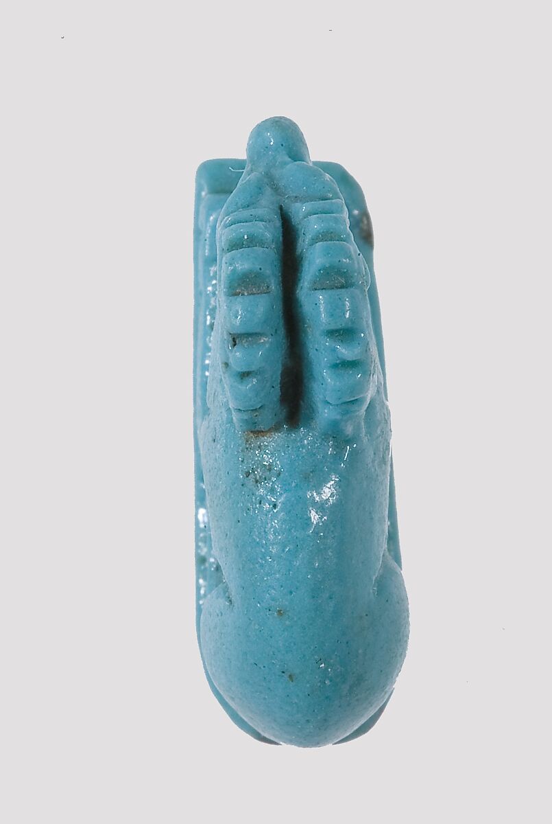 Ibex-Shaped Design Amulet Inscribed With A Crocodile and A Fish, Faience