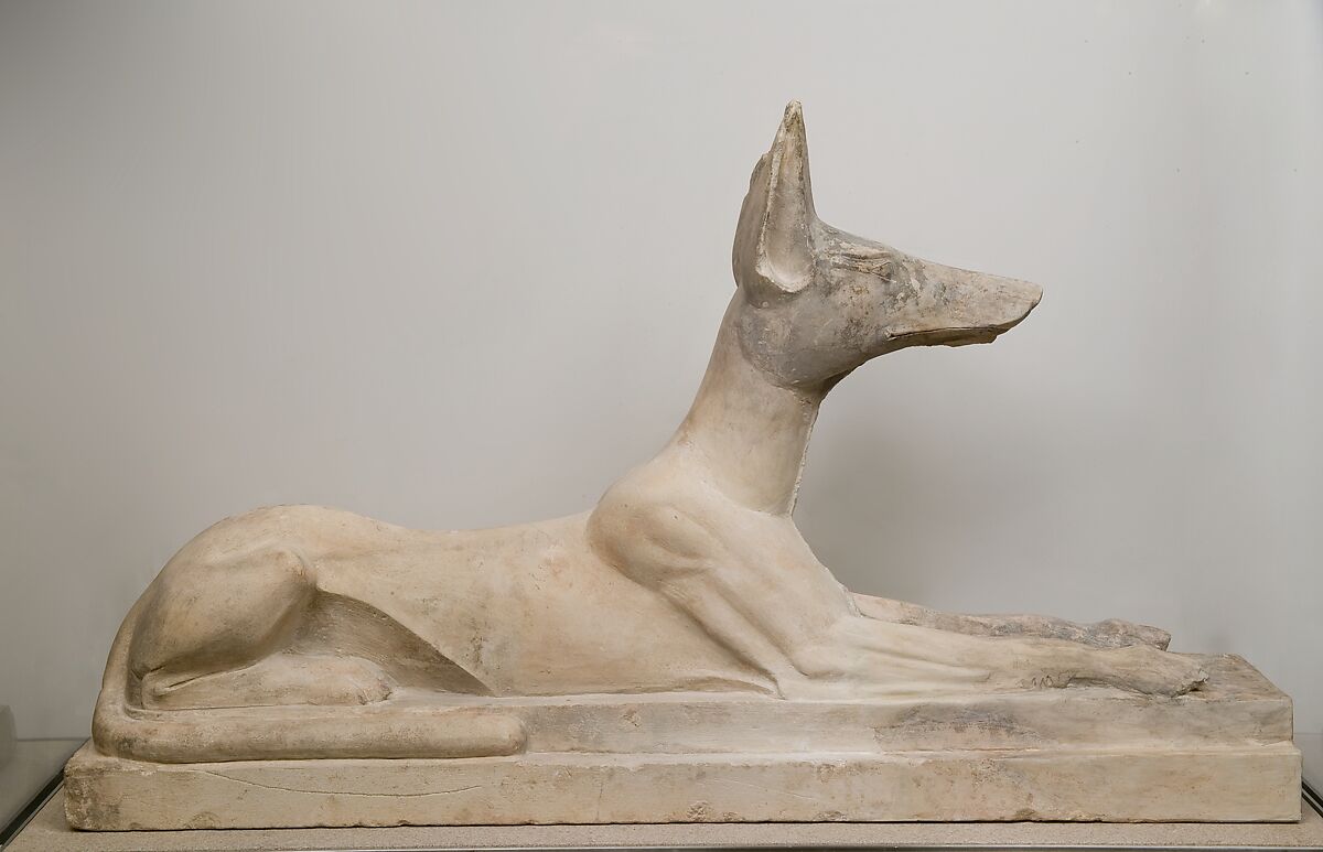 Statue of Anubis as a recumbent canid, Limestone, originally painted black