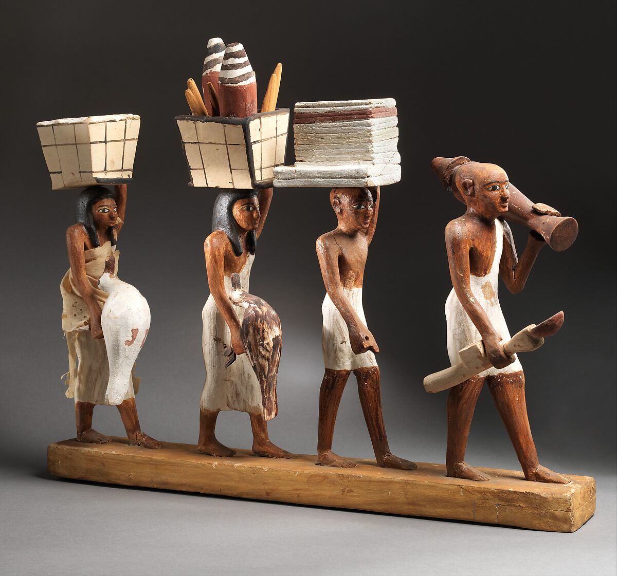 Model of a procession of offering bearers, Plastered and painted wood, linen