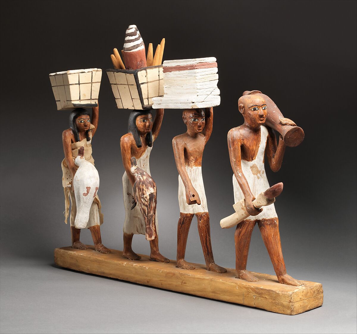 Model of a procession of offering bearers, Plastered and painted wood, linen 