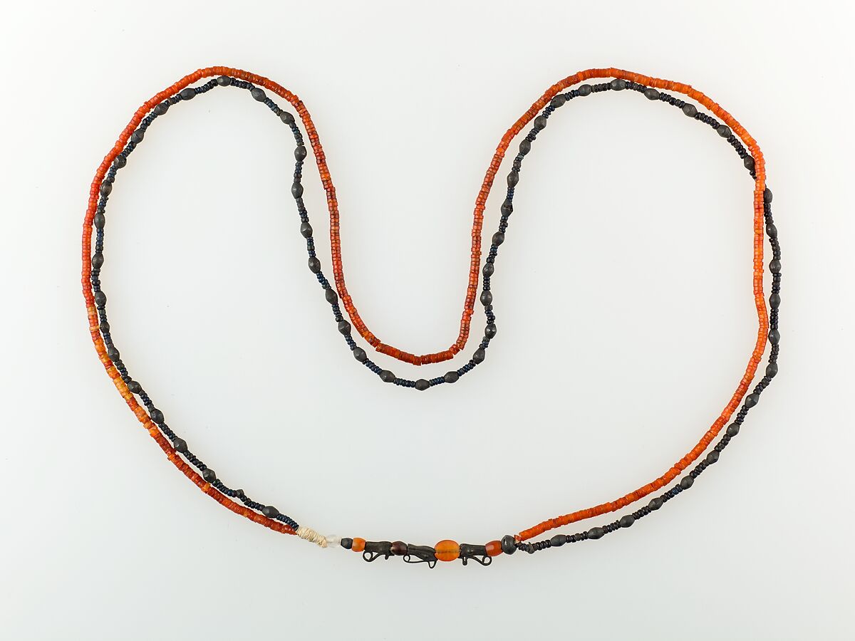 Two-strand Necklace of the Child Myt, Carnelian, glass, silver, rock crystal 