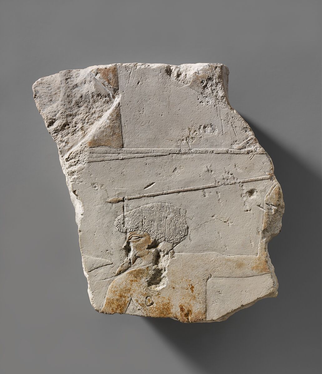 Fragment from a battle scene depicting a foreigner throwing a spear and holding a distinctive shield, Limestone, paint 