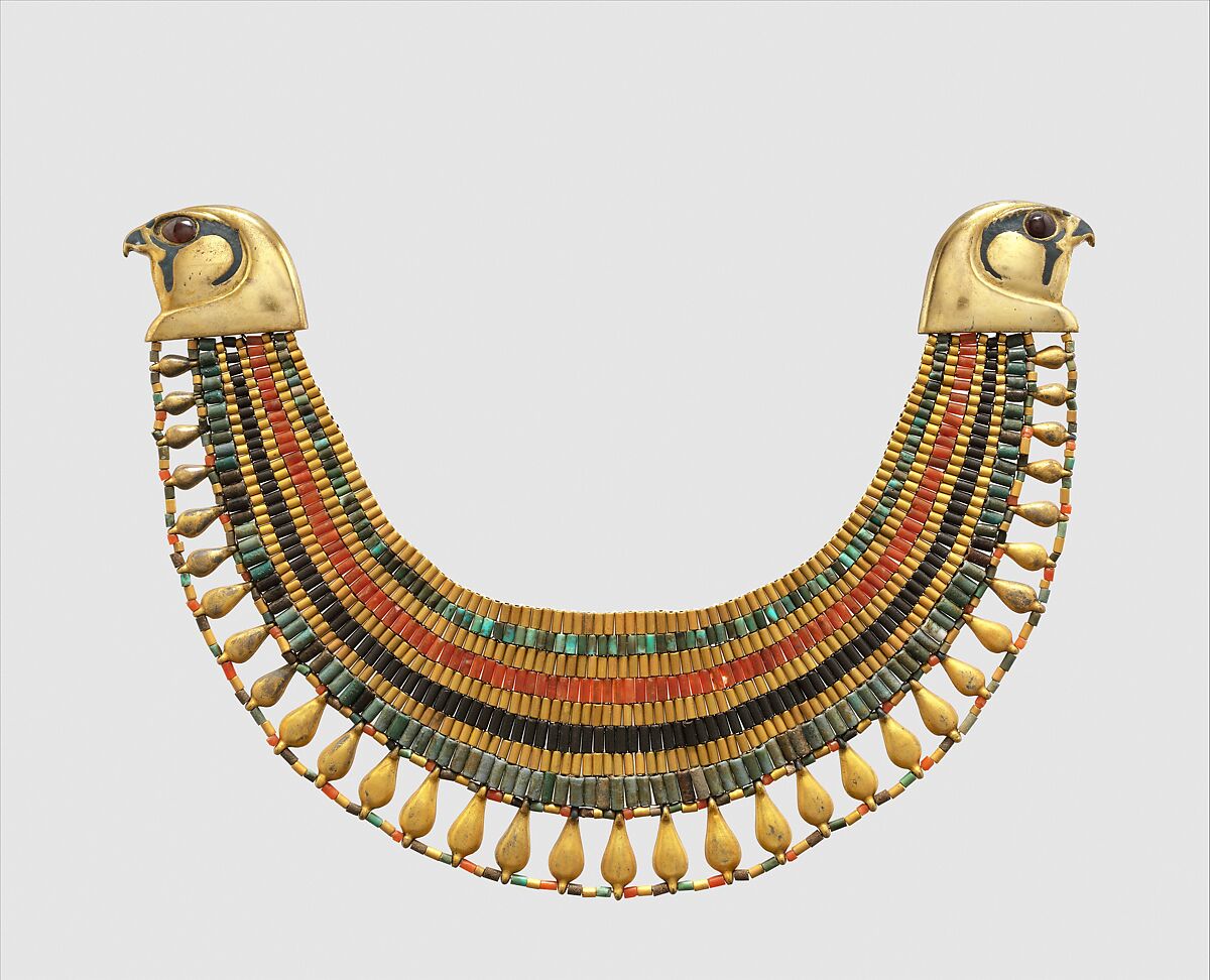 Broad collar of Senebtisi, Faience, gold, carnelian, turquoise.
Falcon heads and leaf pendants originally gilded plaster, restored in gilded silver. Eyes originally gilded beads restored in gilded plaster. 