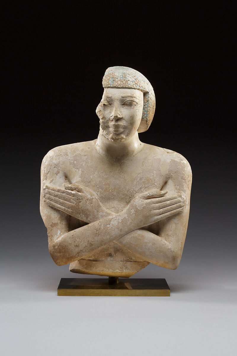 Upper part of a statue of Iqer, Limestone with traces of color 