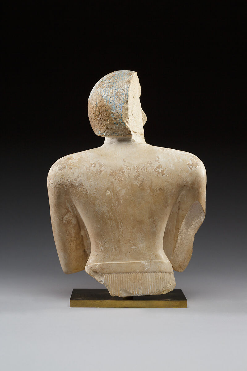 Upper part of a statue of Iqer, Limestone with traces of color