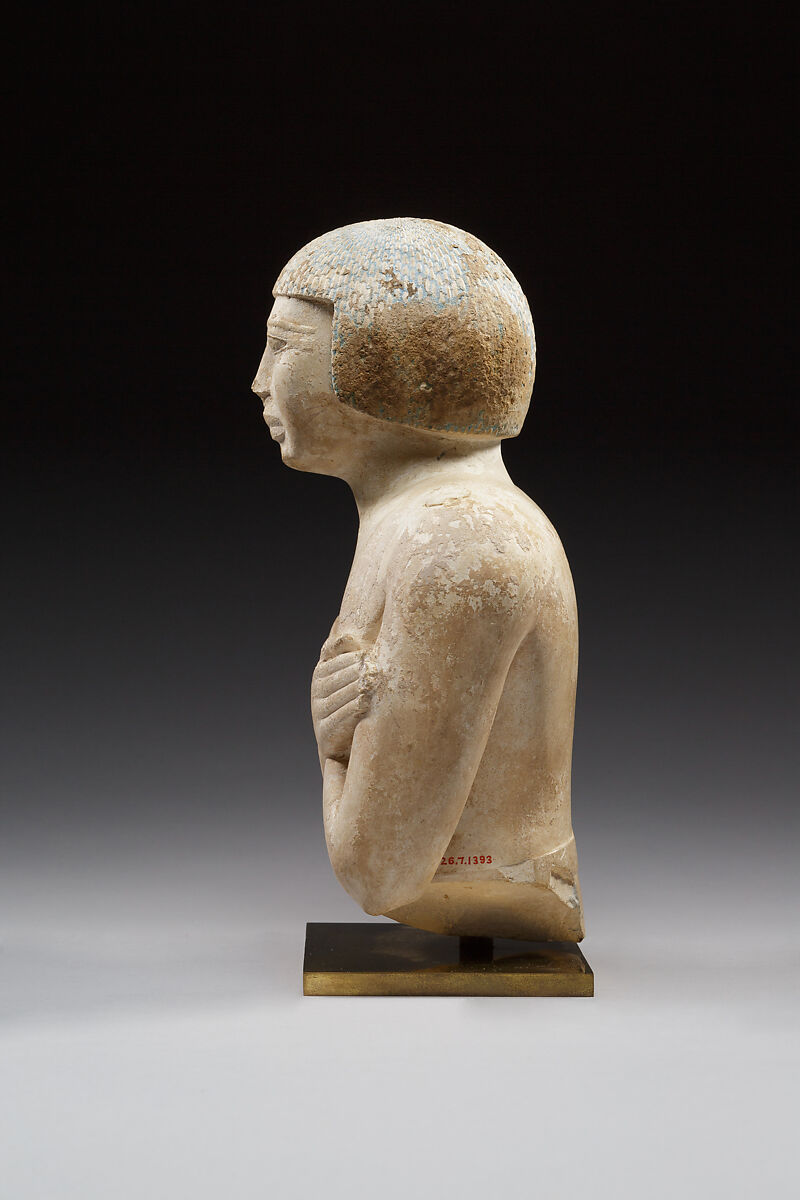Upper part of a statue of Iqer, Limestone with traces of color