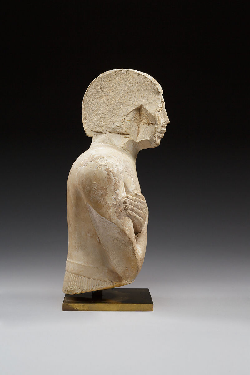 Upper part of a statue of Iqer, Limestone with traces of color