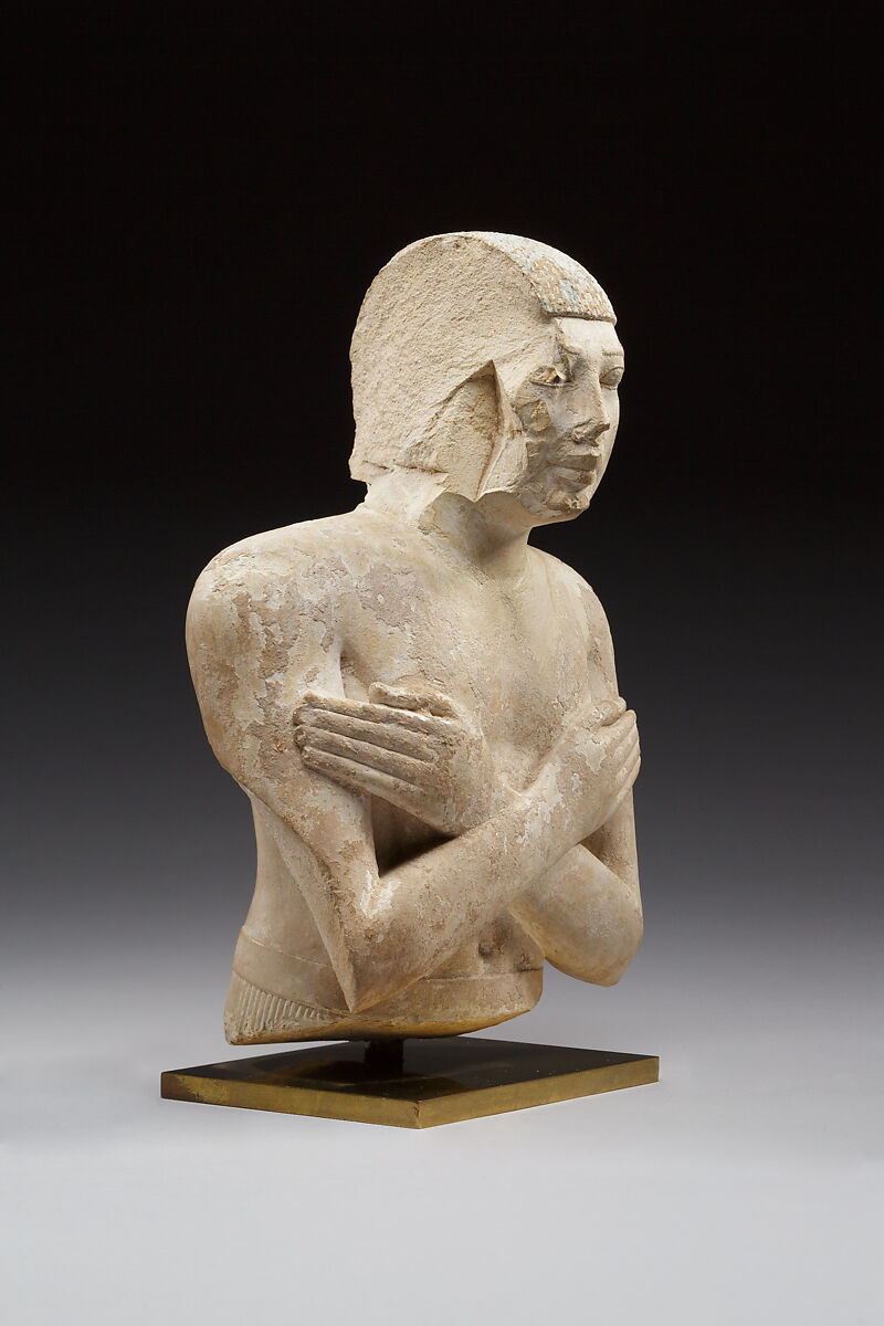 Upper part of a statue of Iqer, Limestone with traces of color