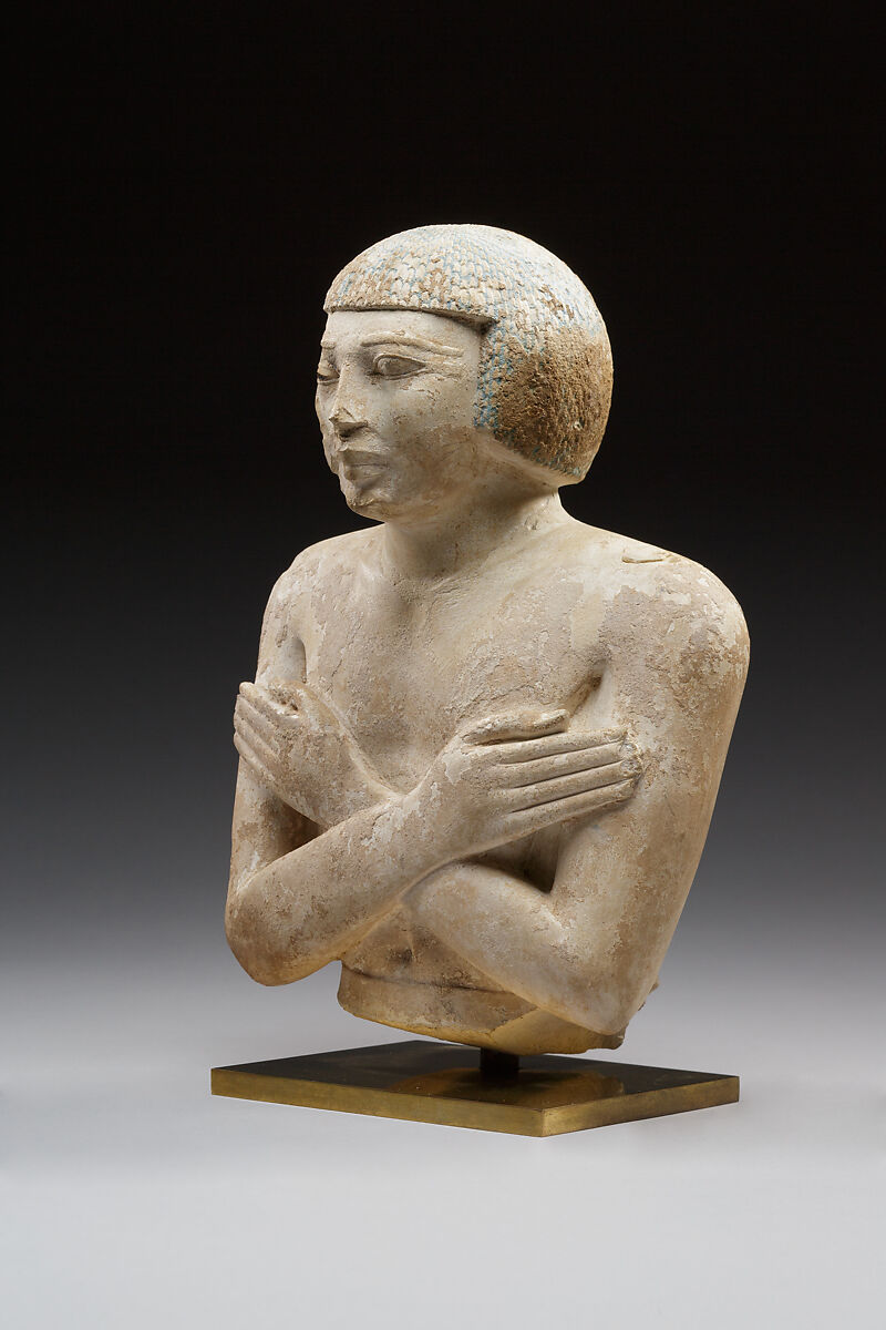 Upper part of a statue of Iqer, Limestone with traces of color