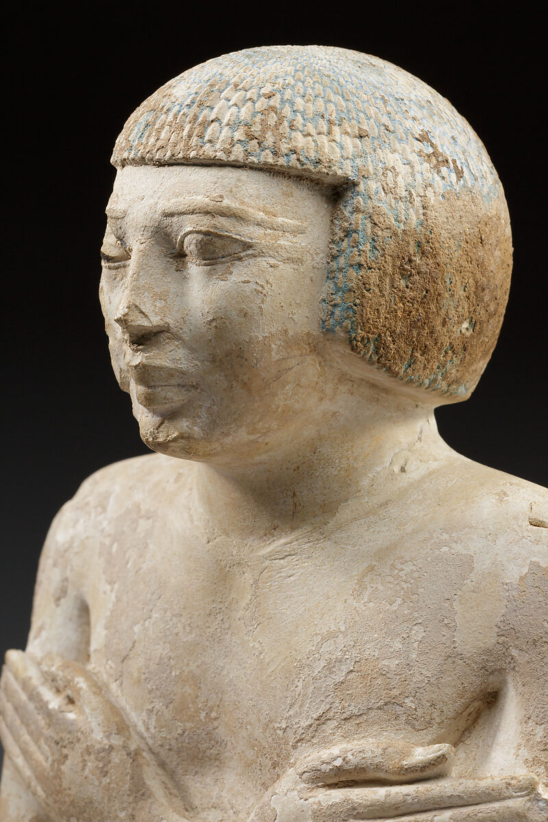 Upper part of a statue of Iqer, Limestone with traces of color