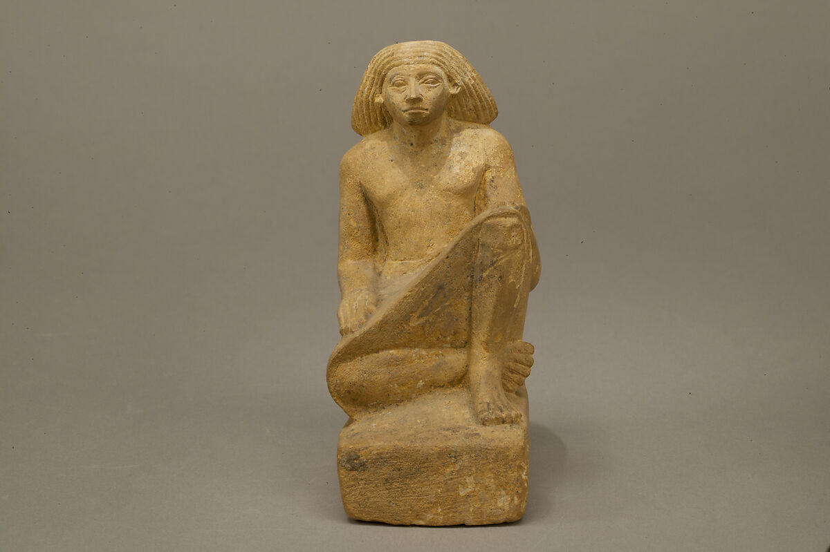 Statue of an asymmetrically seated man, Yellow limonite (G.L.Finlay)