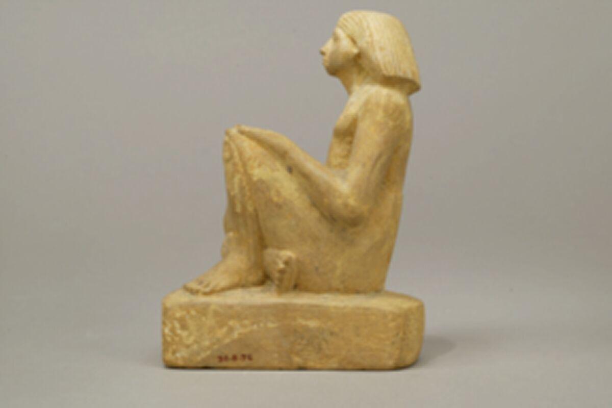 Statue of an asymmetrically seated man, Yellow limonite (G.L.Finlay)