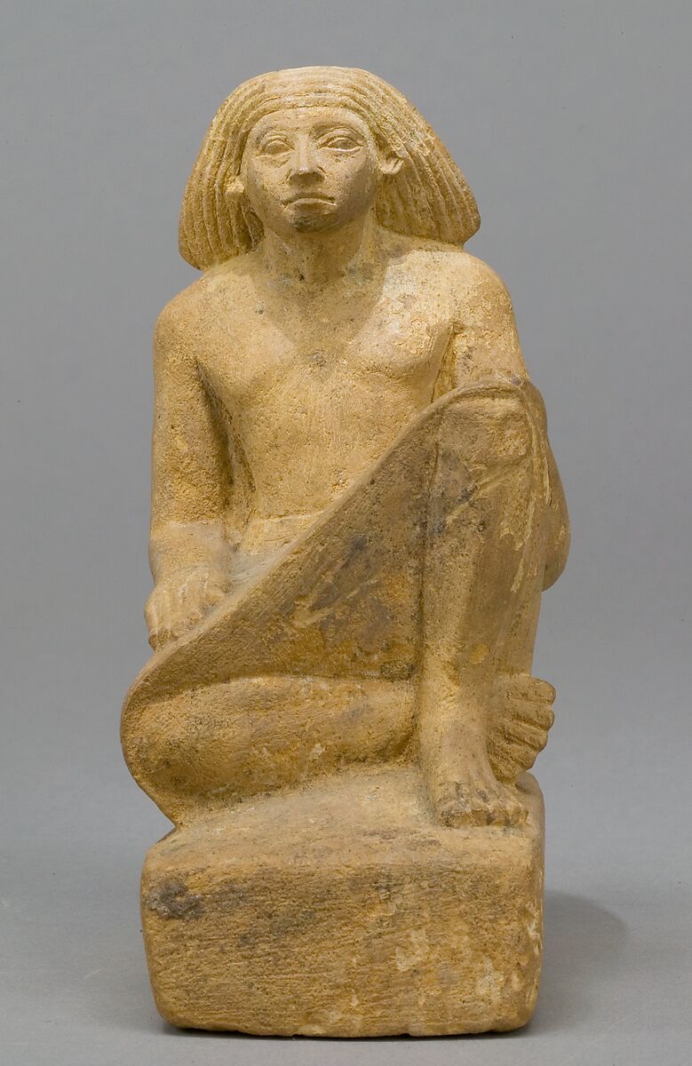 Statue of an asymmetrically seated man, Yellow limonite (G.L.Finlay) 