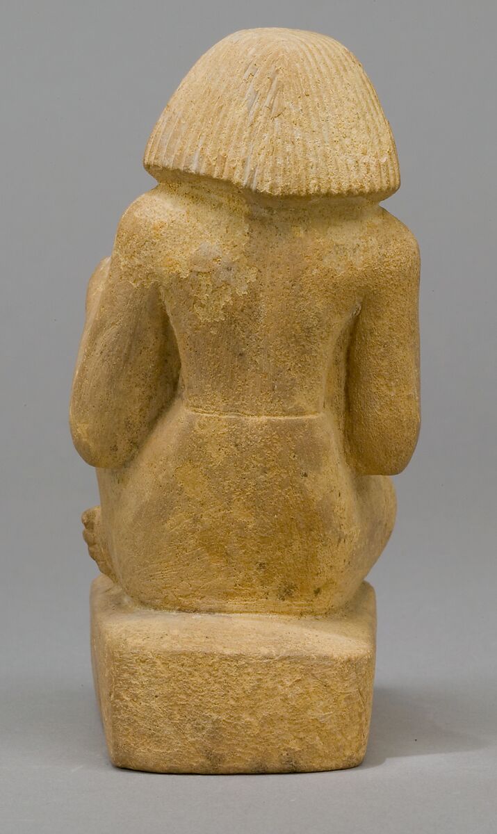Statue of an asymmetrically seated man, Yellow limonite (G.L.Finlay)