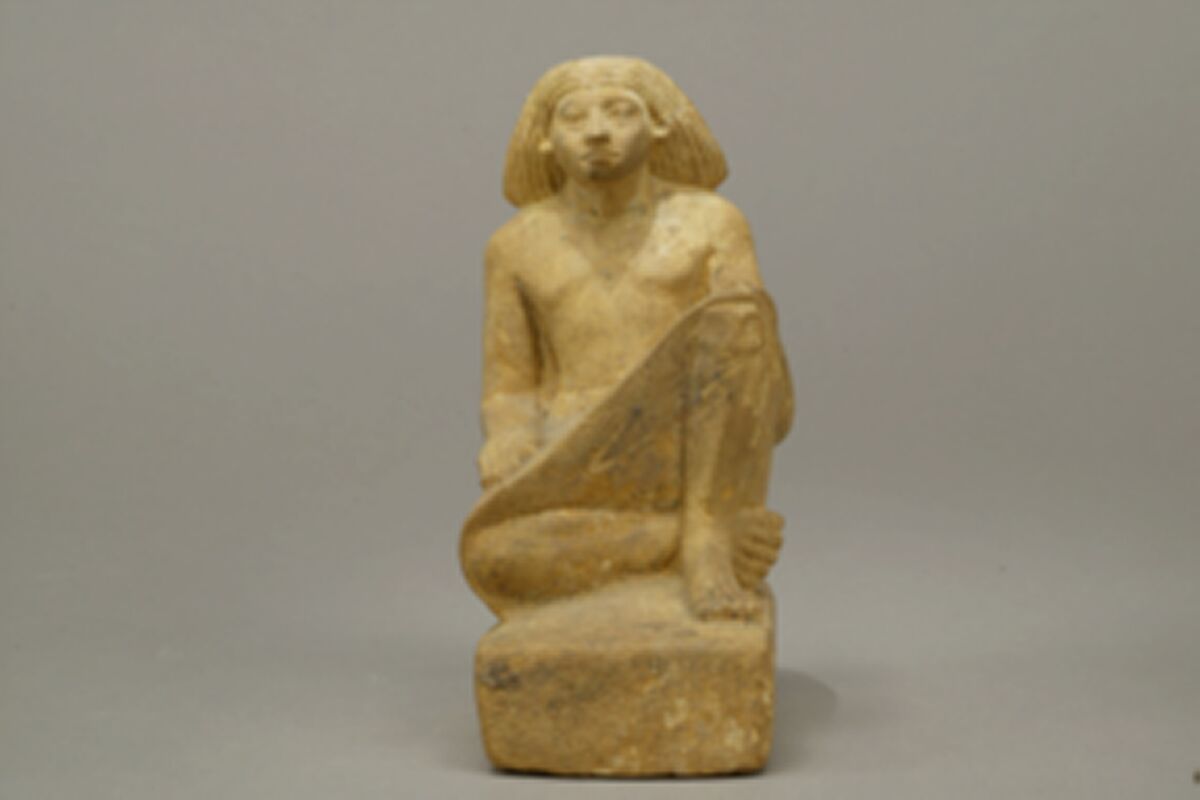 Statue of an asymmetrically seated man, Yellow limonite (G.L.Finlay)