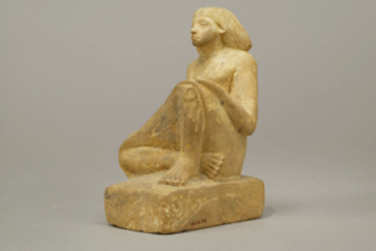 Statue of an asymmetrically seated man, Yellow limonite (G.L.Finlay)