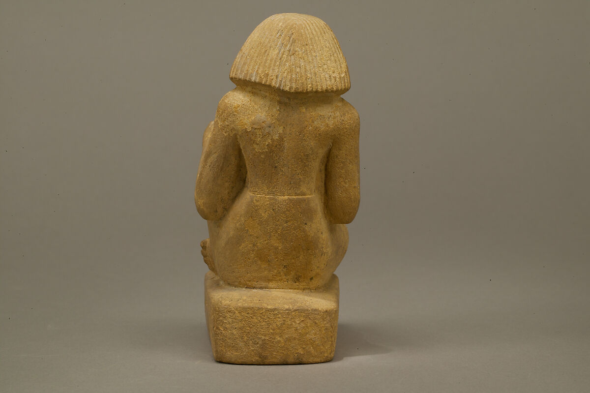 Statue of an asymmetrically seated man, Yellow limonite (G.L.Finlay)