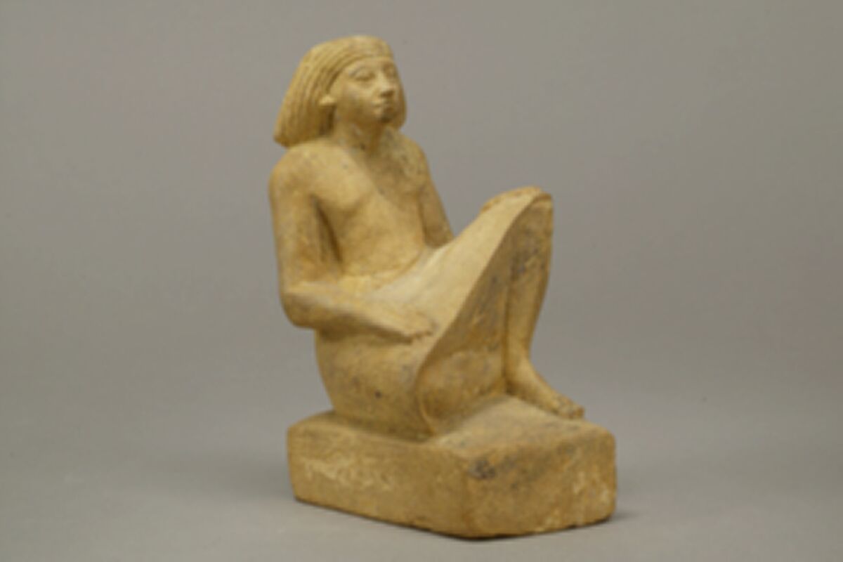Statue of an asymmetrically seated man, Yellow limonite (G.L.Finlay)