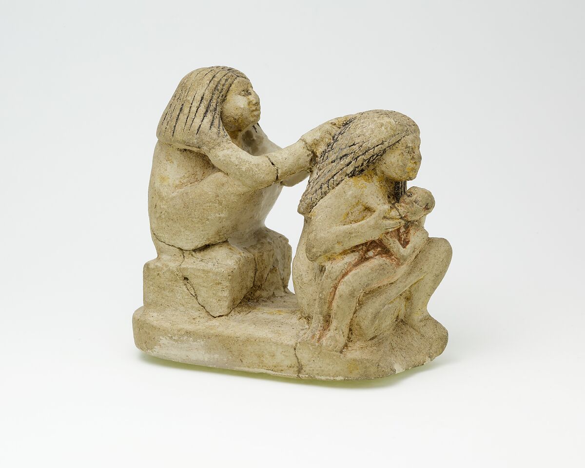 Group of two women and a child, Limestone, paint