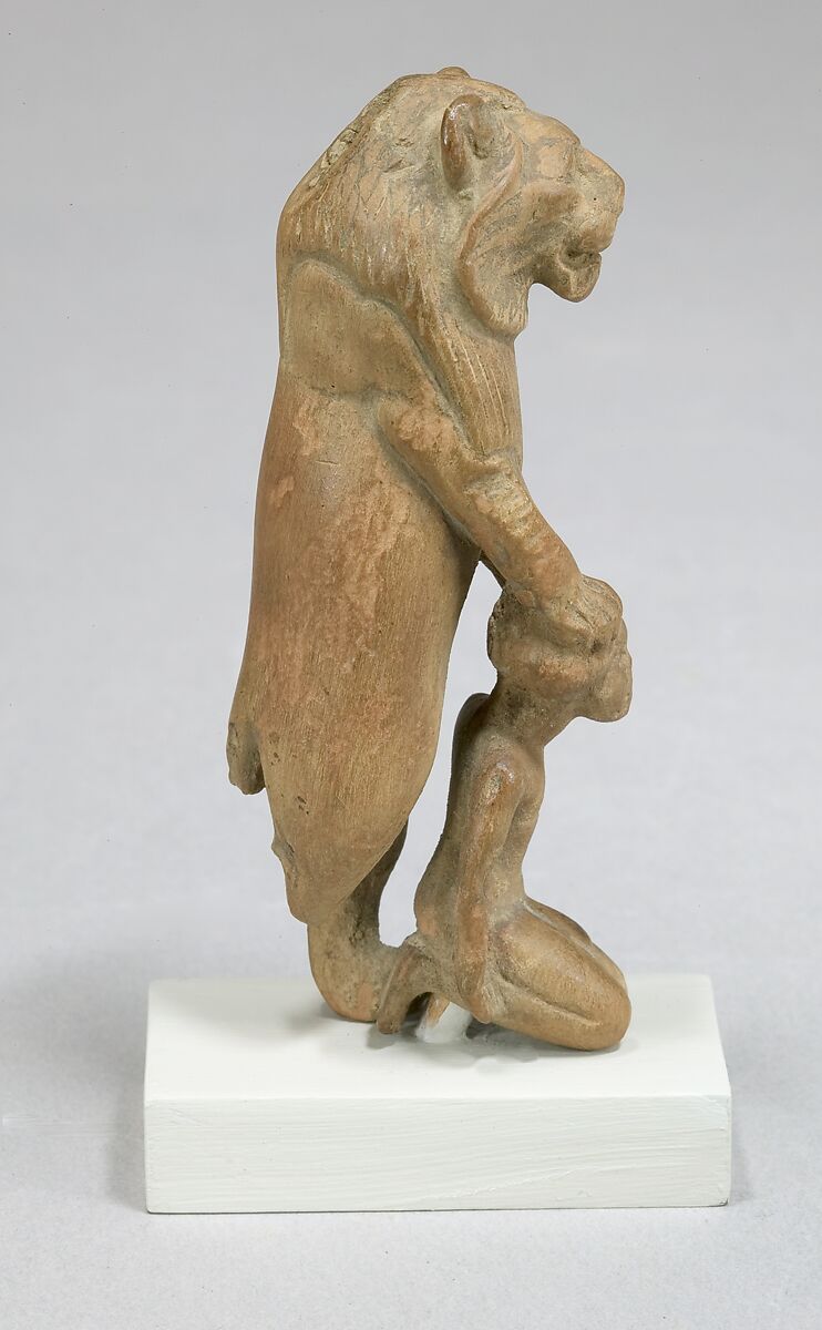 Statuette of lion holding a Nubian captive, Wood