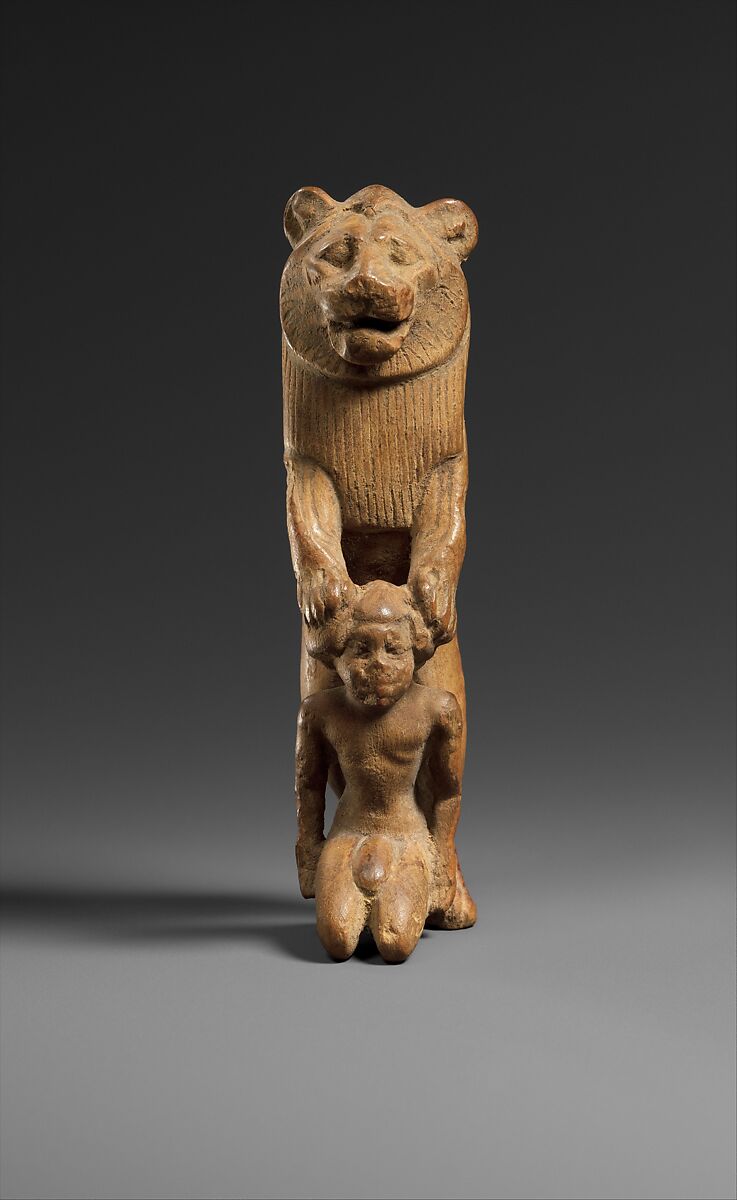 Statuette of lion holding a Nubian captive, Wood