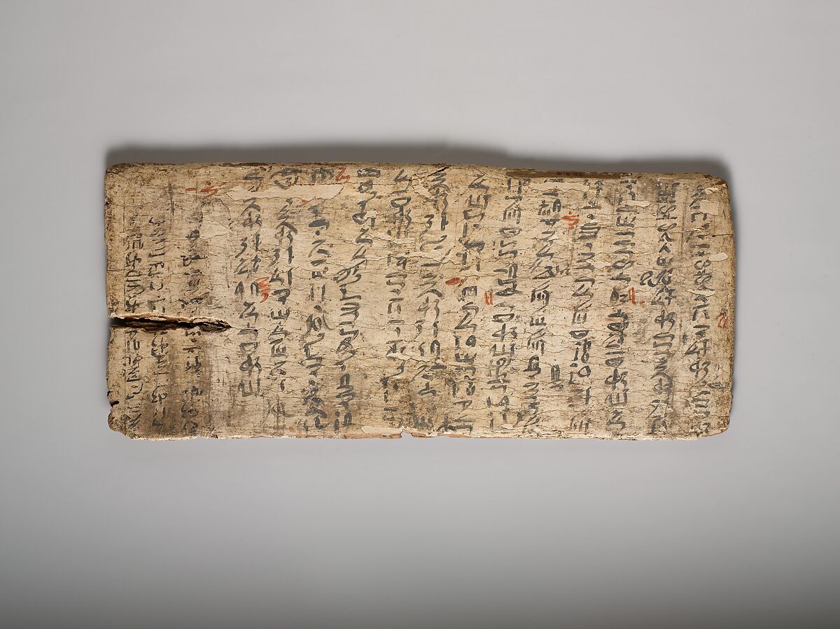 image of ancient African gesso write board with red ink corrections by teacher ca. 1981 B.C.E.