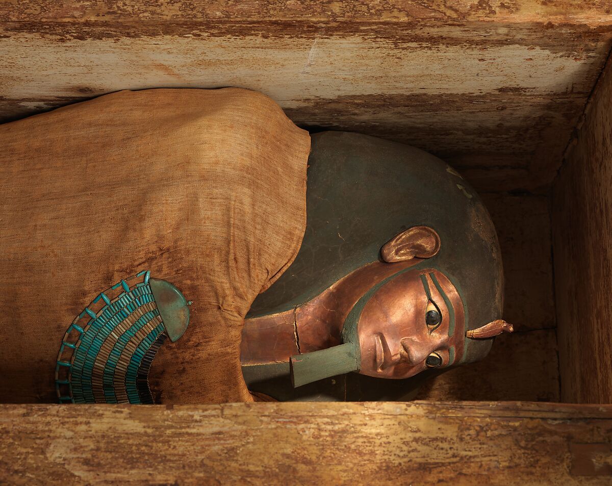 Mummy of Khnumhotep with mask and broad collar, Mummified human body, linen, mummification material, painted and gilded cartonnage, ebony, obsidian, travertine (Egyptian alabaster), faience