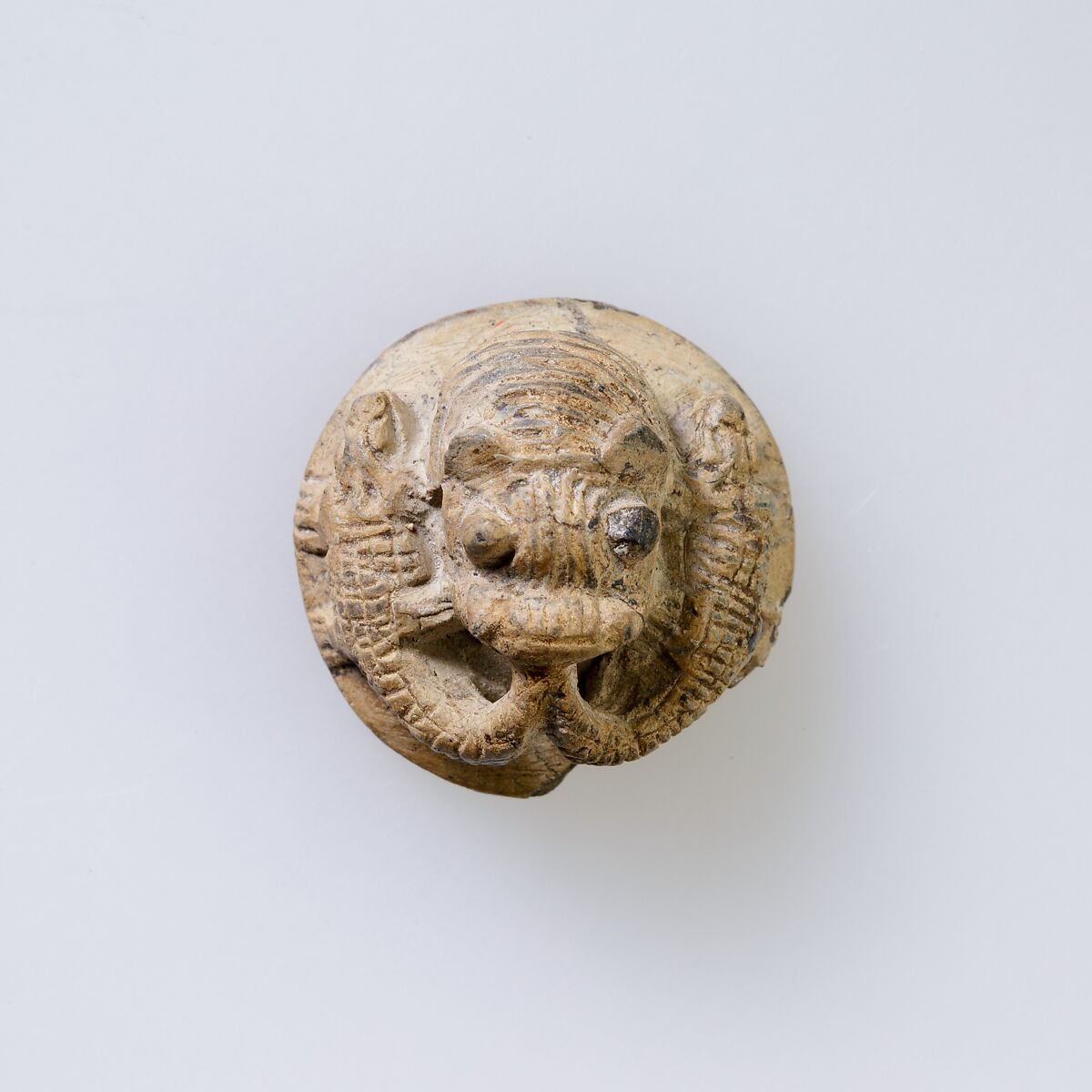 Hippopotamus-Head Design Amulet Inscribed With Four Linked Ibex Heads., Steatite, white glazed 