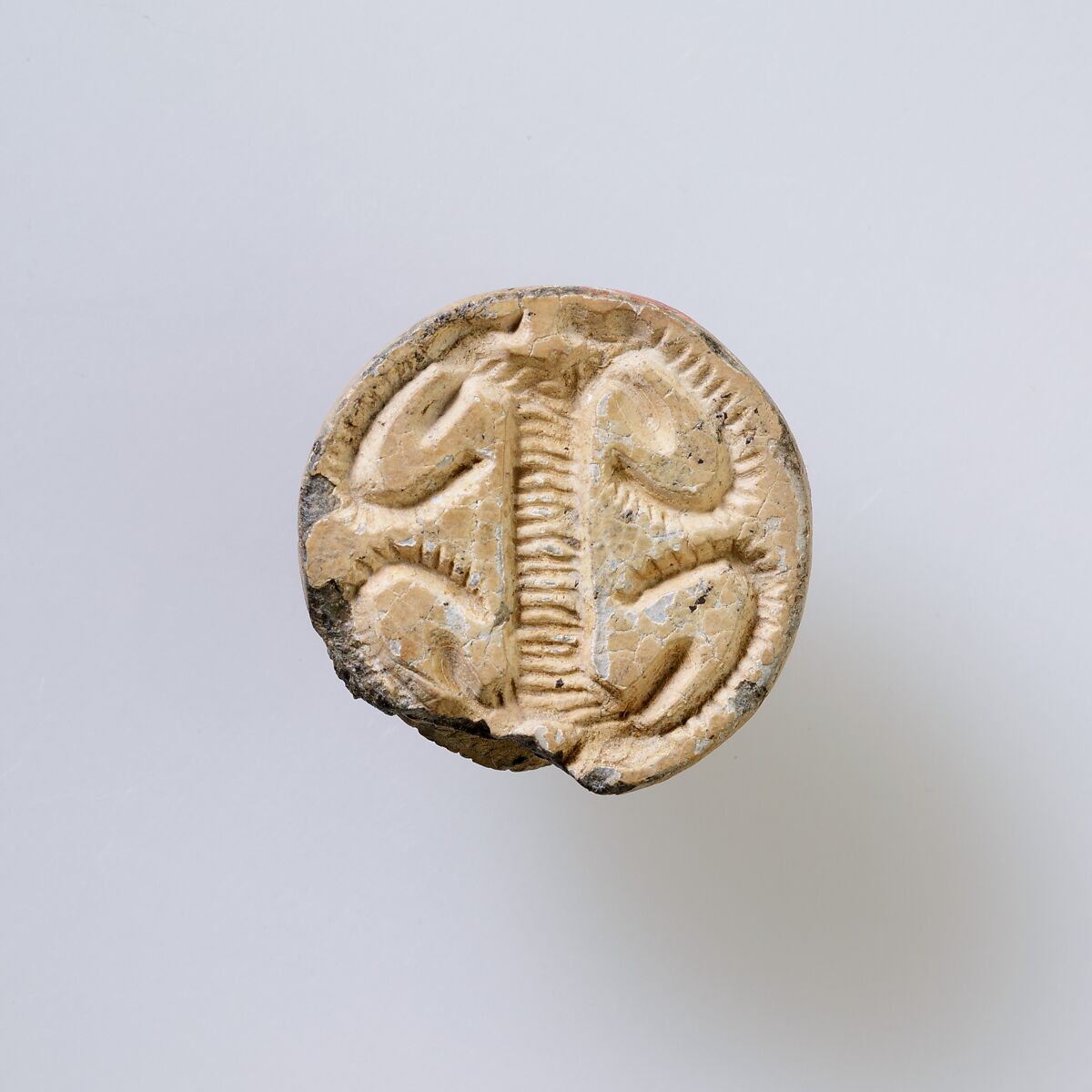 Hippopotamus-Head Design Amulet Inscribed With Four Linked Ibex Heads., Steatite, white glazed