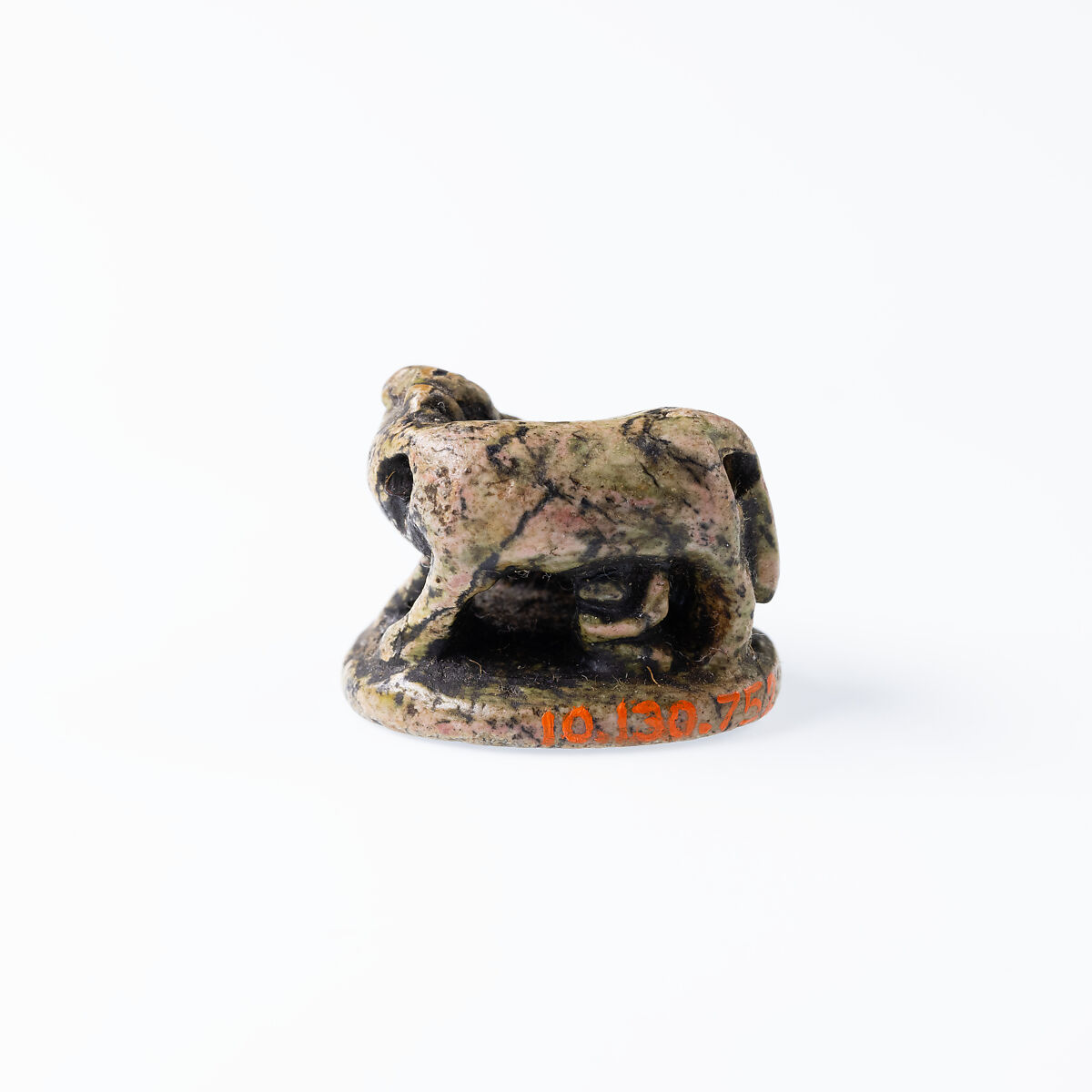 Design Amulet, Cow Nursing Calf and also a Kneeling Suckling Man Visible on Opposite Side on the Back, Device showing Antithetical Falcons with an Ankh Sign over a Lion, Steatite, glazed