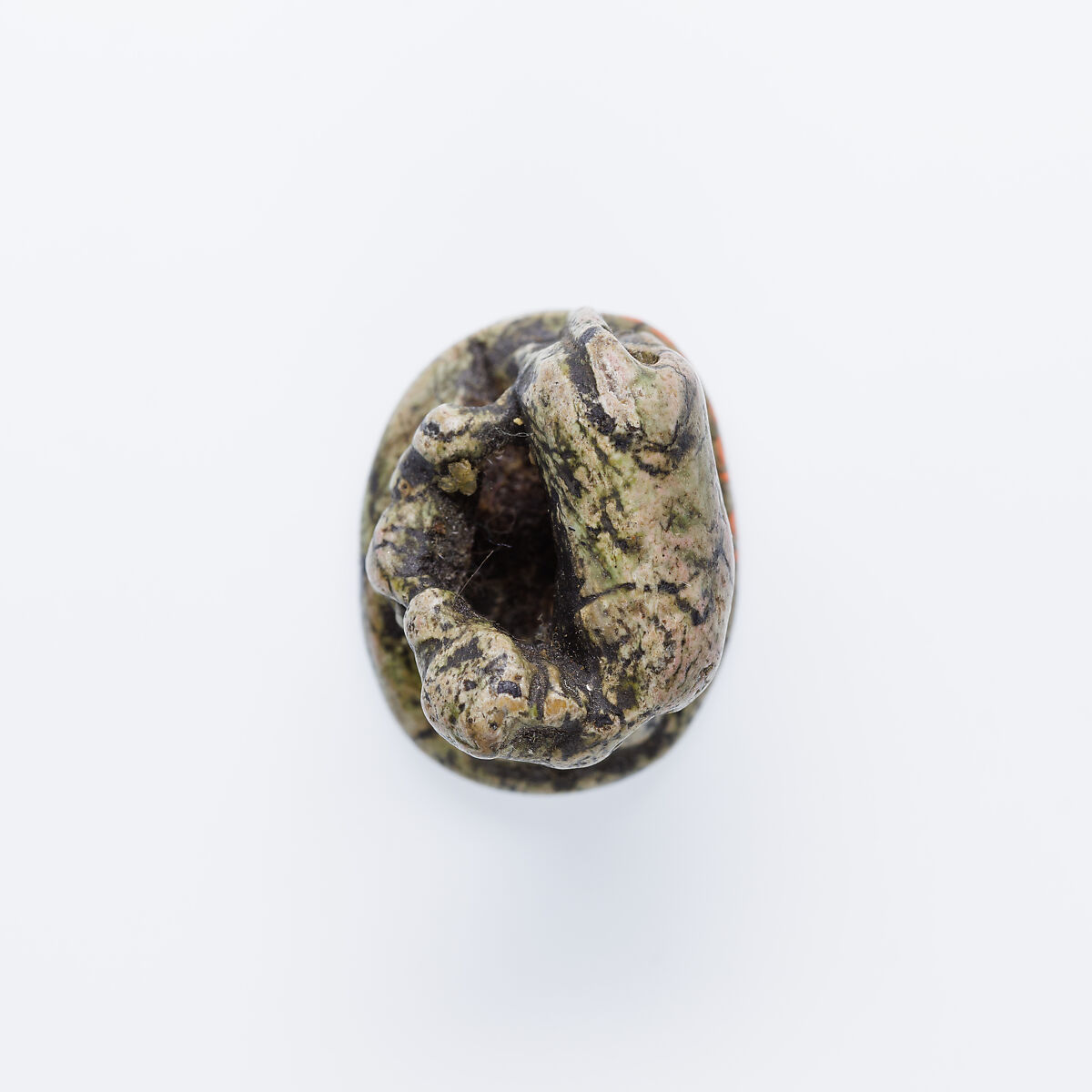 Design Amulet, Cow Nursing Calf and also a Kneeling Suckling Man Visible on Opposite Side on the Back, Device showing Antithetical Falcons with an Ankh Sign over a Lion, Steatite, glazed