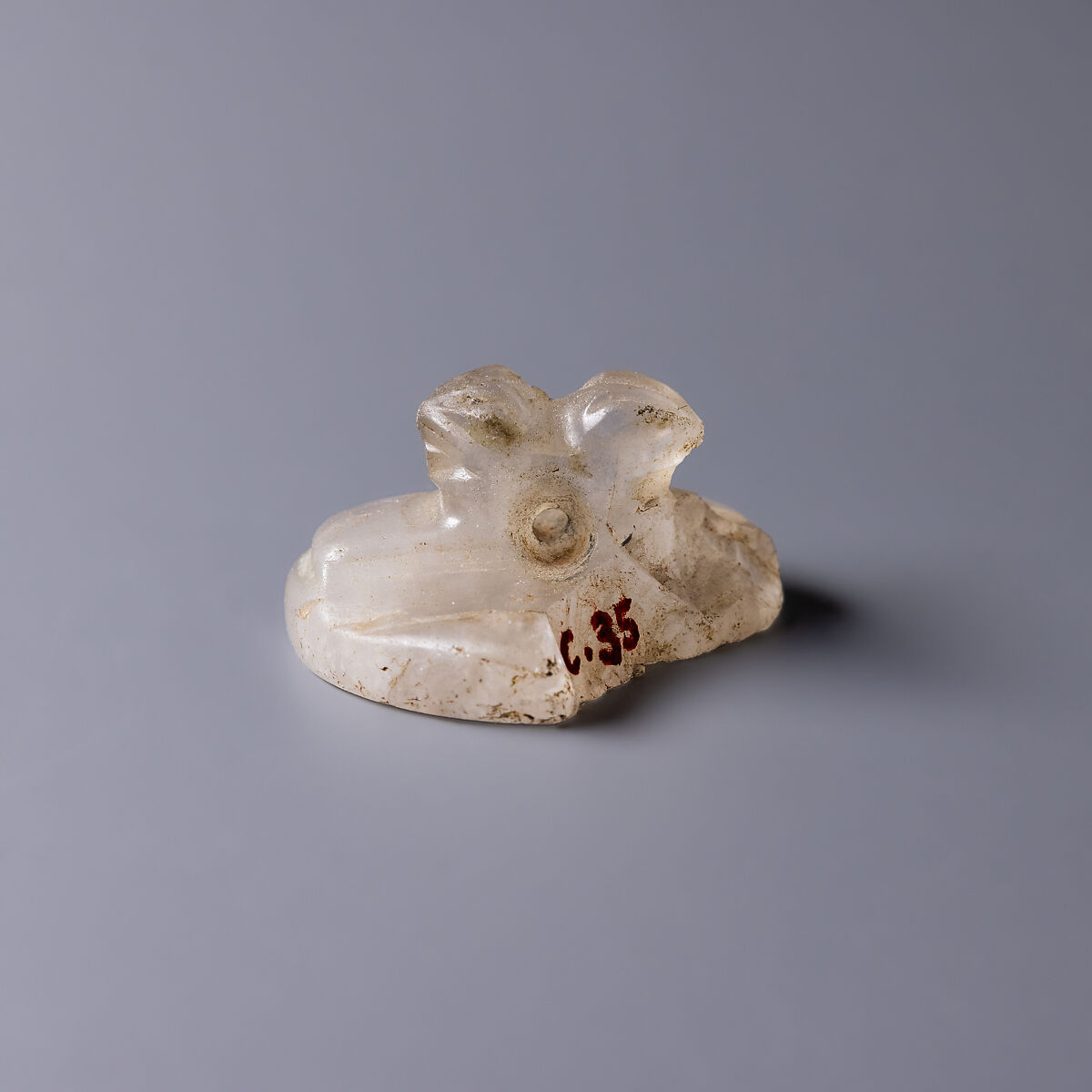 Design Amulet, a Double-Falconhead Shank Pierced Transversally on the Back, Device showing Two Hares Head-to-tail, Rock crystal