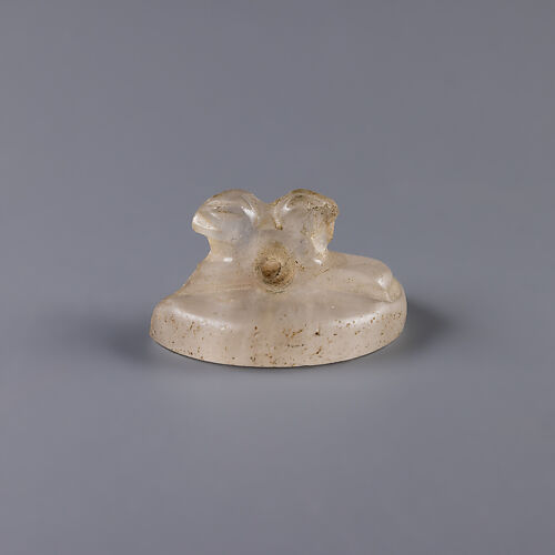 Design Amulet, a Double-Falconhead Shank Pierced Transversally on the Back, Device showing Two Hares Head-to-tail