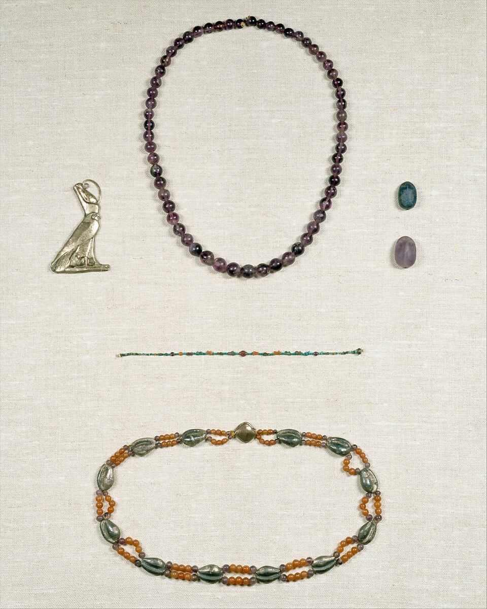 Pendant of Horus wearing the double crown, Electrum over plaster