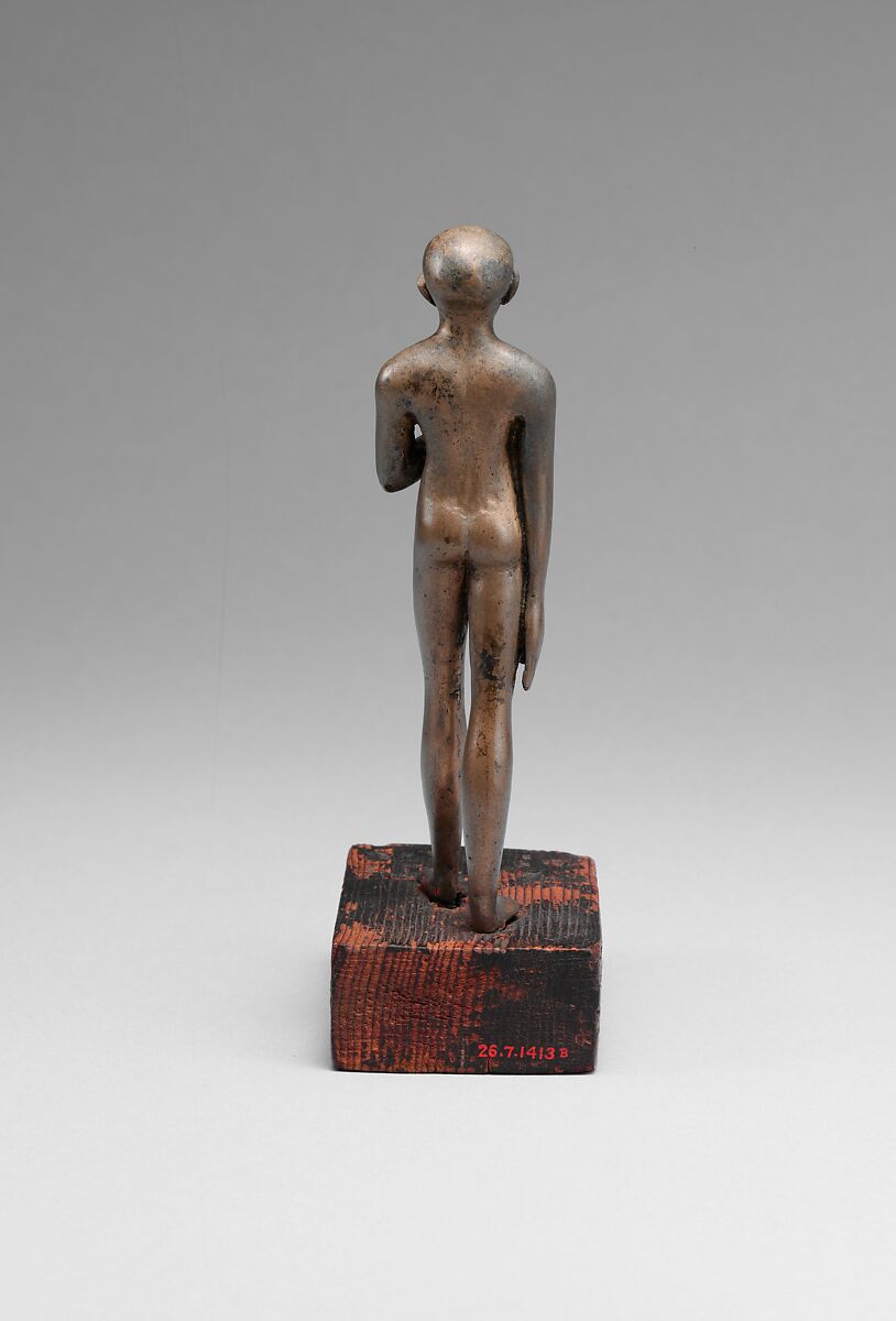 Statuette of the Child Amenemhab, Bronze, separate silver lotus, wood base with pigmented inlays