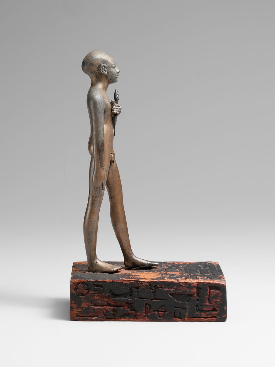 Statuette of the Child Amenemhab, Bronze, separate silver lotus, wood base with pigmented inlays