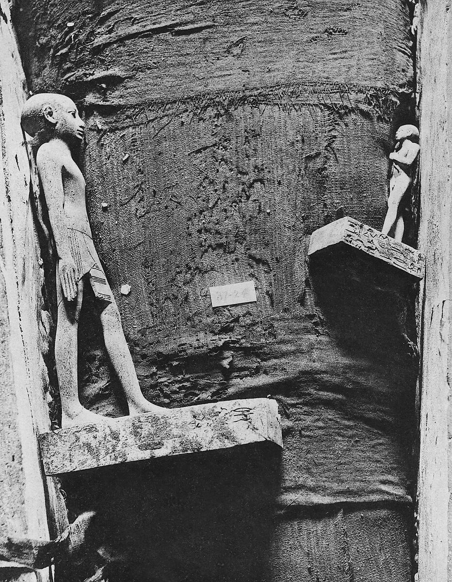 Statuette of the Child Amenemhab, Bronze, separate silver lotus, wood base with pigmented inlays