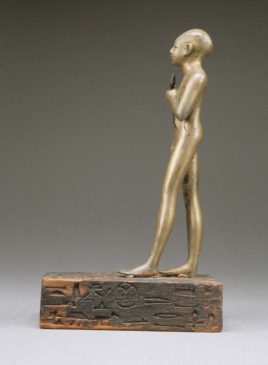 Statuette of the Child Amenemhab, Bronze, separate silver lotus, wood base with pigmented inlays