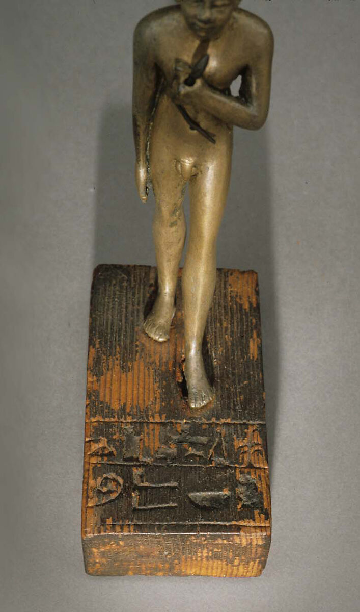 Statuette of the Child Amenemhab, Bronze, separate silver lotus, wood base with pigmented inlays