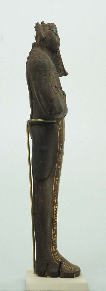 Shabti of Amenhotep III, Ebony; eyes inlaid with blue, white, black glass;  inscription filled with pigment