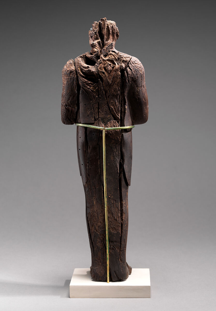 Shabti of Amenhotep III, Ebony; eyes inlaid with blue, white, black glass;  inscription filled with pigment