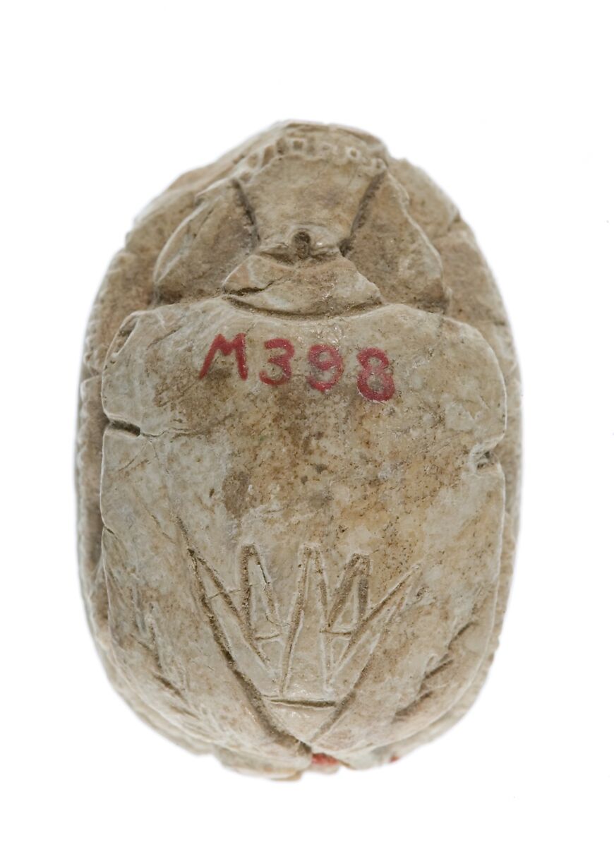 Scarab with a Crocodile Headed Figure Holding a Flower, Glazed steatite