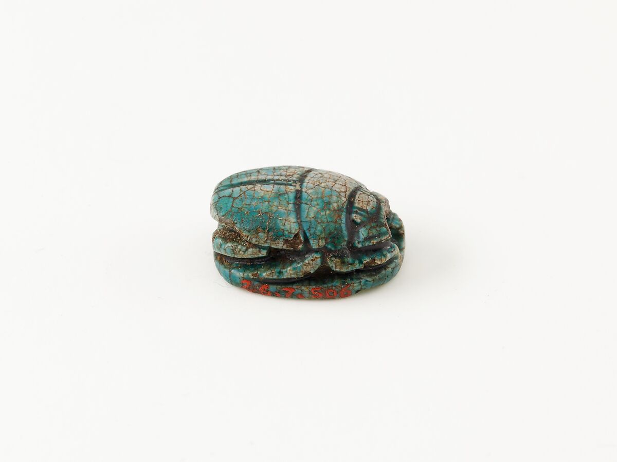 Scarab depicting a kneeling man (?), Steatite (glazed)