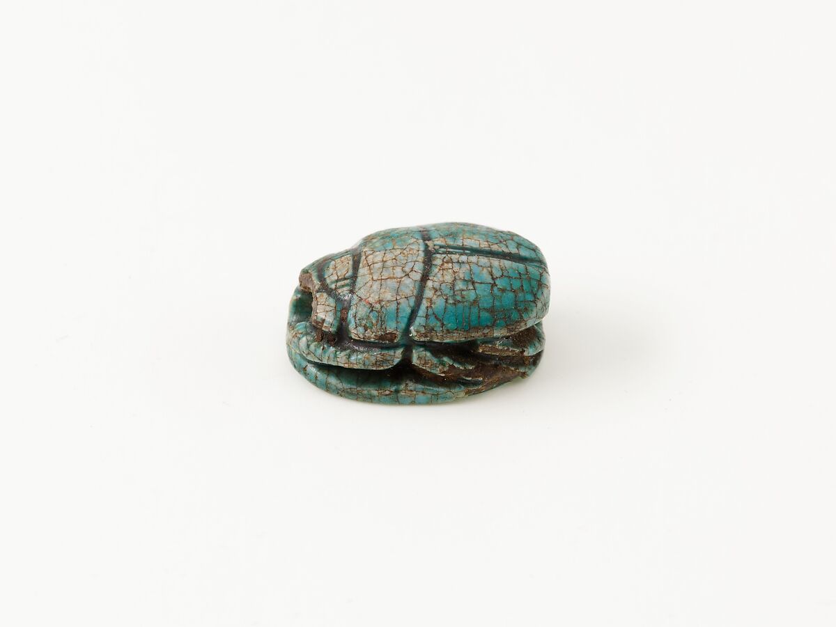 Scarab depicting a kneeling man (?), Steatite (glazed)