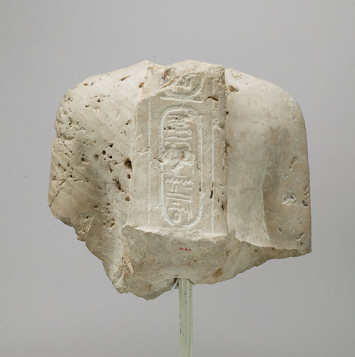 Torso of Nefertiti from a dyad holding a stela in front of the bodies, Indurated limestone