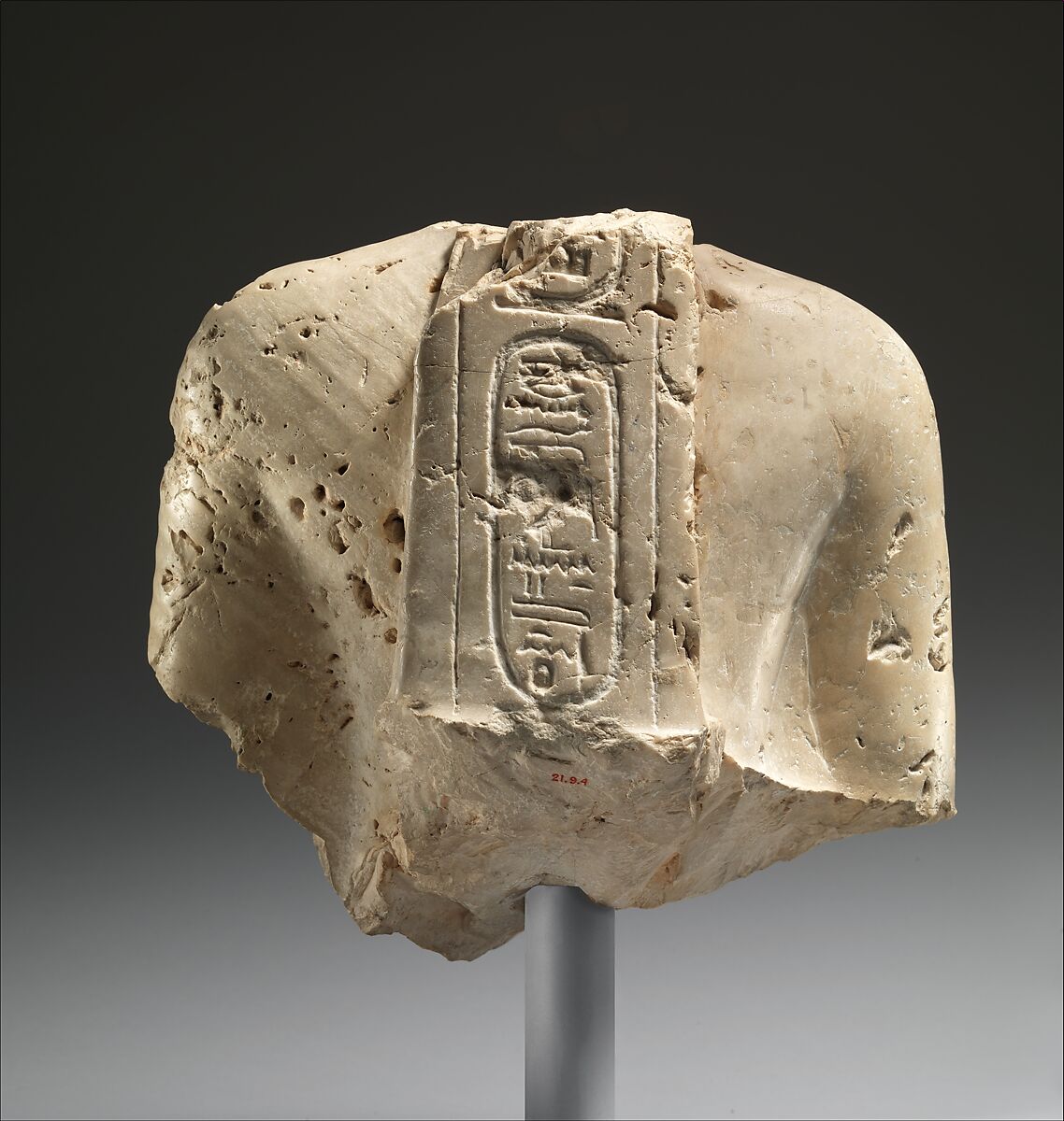 Torso of Nefertiti from a dyad holding a stela in front of the bodies, Indurated limestone