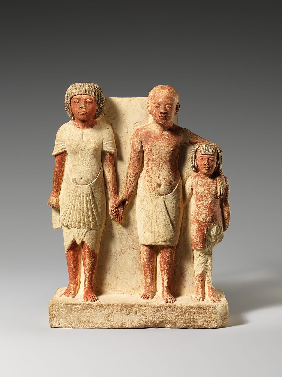 Statue of two men and a boy that served as a domestic icon, Limestone, paint 