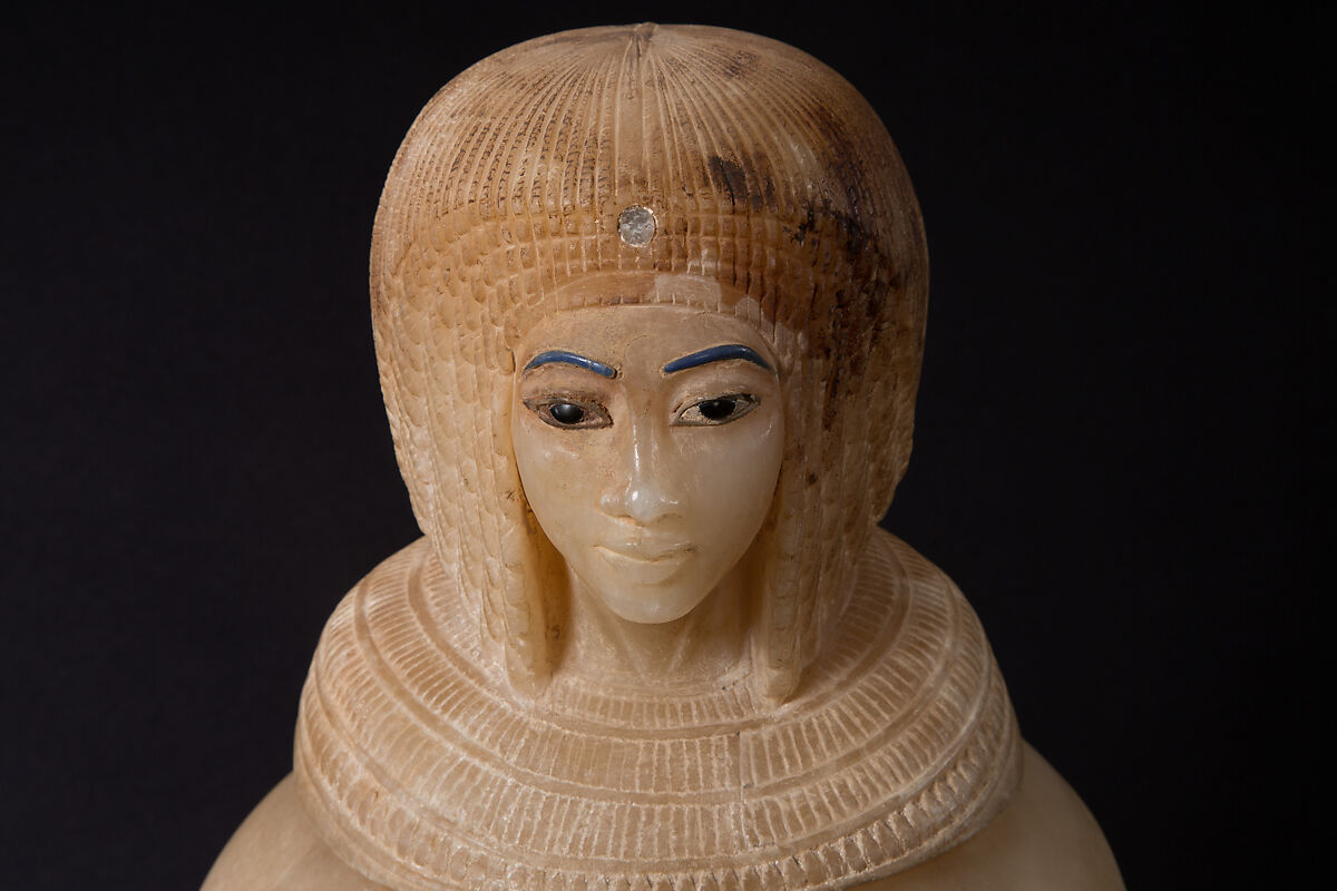 Canopic Jar (07.226.1) with a Lid Depicting a Queen (30.8.54), Travertine (Egyptian alabaster), blue glass, obsidian, unidentified stone