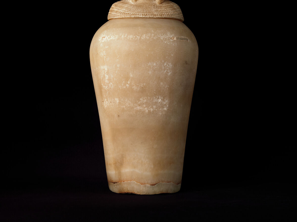 Canopic Jar (07.226.1) with a Lid Depicting a Queen (30.8.54), Travertine (Egyptian alabaster), blue glass, obsidian, unidentified stone